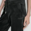 Joggersy slim fit z welurowym haftowanym logo