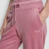 Joggersy slim fit z welurowym haftowanym logo