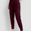 Joggersy slim fit z welurowym haftowanym logo