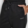 Joggersy z mankietami i logo z cyrkoniami