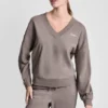 Sweter z dekoltem w serek i metalicznym logo