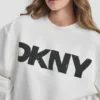 Sweter z długimi rękawami, miękkim materiałem typu scuba i logo