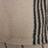 Swetr bez rękawów z detalami w paski